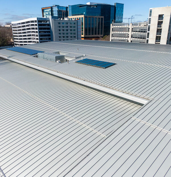 Aerial view of commercial flat roof with skylights, ideal for reroofing and large-loss restoration.